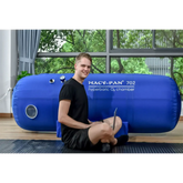 Macy-Pan Hyperbaric Oxygen Therapy Chamber ST702 with user, designed for recovery and performance optimization.